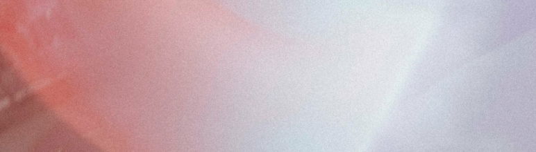 close up of sunlight refracting on lens in purple and pinks