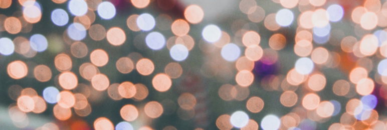 close up of blurry lights with figure of a human in the background