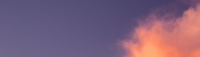 close up image of pink cloud over purple sky
